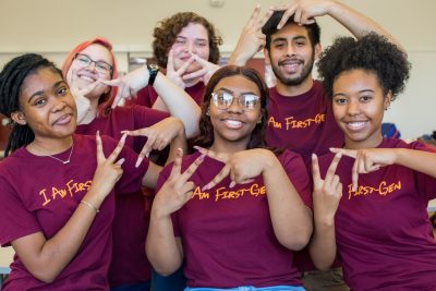A group of first-generation students wearing matching t-shirts at a first-generation students event in 2019.